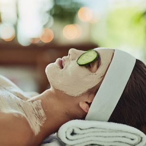 Woman with Cucumber on Eyes